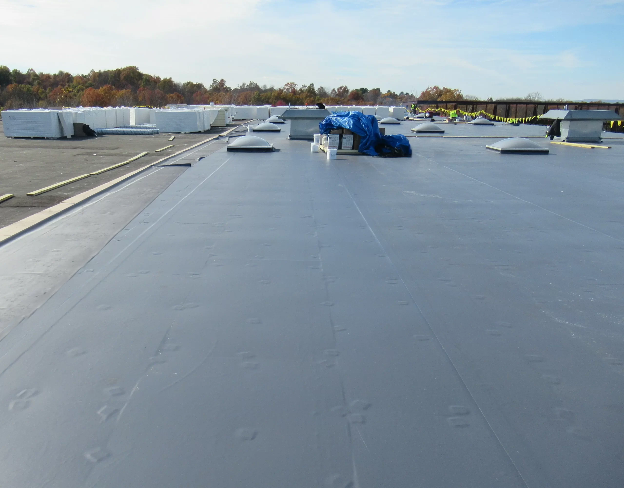 Removal of old roof down to the deck in Middletown, NY, with new R30+ insulation and 50 mil PVC membrane installed.